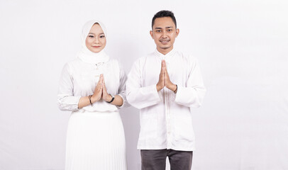 Asian moslem couple greeting gesture on ramadhan isolated