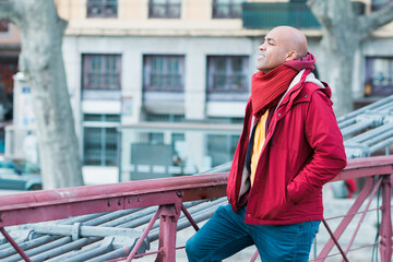 Concept of business, technology, communication and people - smiling businessman with smart phone talking on city background.