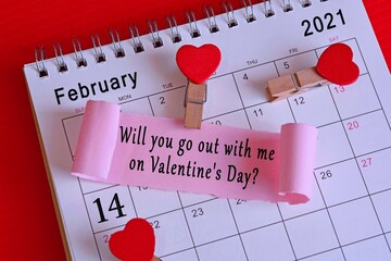 Torn paper on February calendar 2021 with phase . Valentine's Day concept