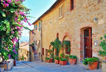 Fototapeta na wymiar old alley in the village of Castiglione della Pescaia, a famous medieval town overlooking the Tuscan coast in the province of Grosseto, Italy