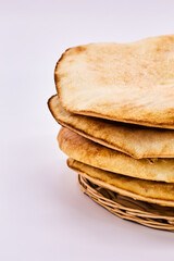 Highlight the Arabic Bread - Lavash-on a white background. Four pita bread, simple bread to eat