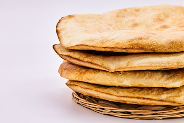 Highlight the Arabic Bread - Lavash-on a white background. Four pita bread, simple bread to eat