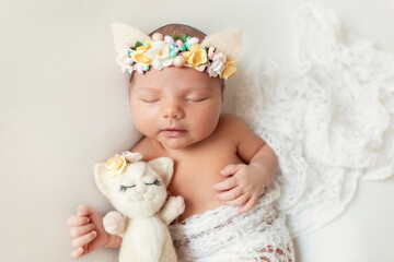Fototapeta premium Sleeping newborn baby. Healthy child, concept of hospital and happy motherhood. Infant baby. Healthy and medical concept. Happy pregnancy and childbirth. Children's theme. Baby and childen's goods.