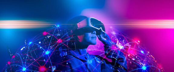 Young woman using glasses of virtual reality on dark background. Smartphone using with VR...