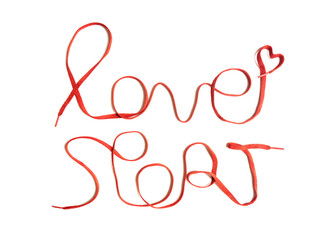 Red athletic shoe laces arranged in shape of the lettering 