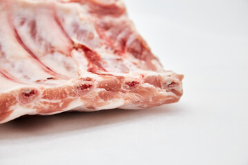 A piece of fresh raw meat pulp on a white background, isolated. The concept of cooking dishes from fresh meat, beef, bones, the best restaurant, delicious cuisine