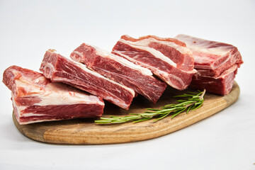 Fototapeta premium A piece of fresh raw meat pulp on a white background, isolated. The concept of cooking dishes from fresh meat, beef, bones, the best restaurant, delicious cuisine