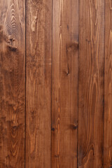 Brown wooden background. textures textured rustic board. Wooden Wall Covering Of Vertical Texture. Battered Background. Weathered Vintage Surface. Rough External Structure. old grunge wood paneling.