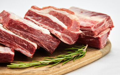 A piece of fresh raw meat pulp on a white background, isolated. The concept of cooking dishes from fresh meat, beef, bones, the best restaurant, delicious cuisine