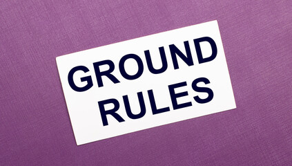 On a lilac background, a white card with the words GROUND RULES