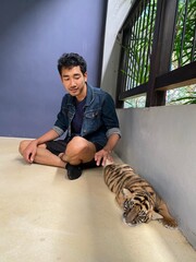 Man and baby tiger