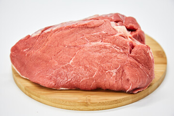 A piece of fresh raw meat pulp on a white background, isolated. The concept of cooking dishes from fresh meat, beef, bones, the best restaurant, delicious cuisine