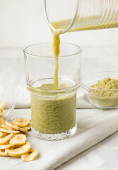 Matcha tea on a gray background. Cooking. Healthy breakfast concept