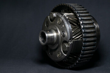 Planetary gear close up on black background, macro photo