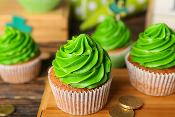 Tasty cupcakes for St. Patrick's Day on table