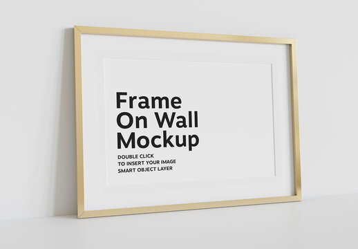 Golden Frame Leaning on Wall Mockup