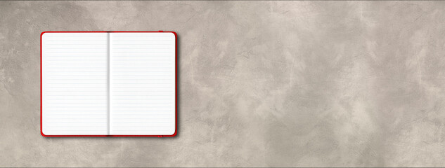 Red open lined notebook isolated on concrete background. Horizontal banner