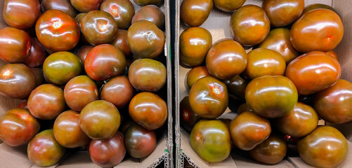 Cardboard box full of tomatoes.healthy food concept.