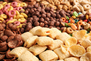 Heap of tasty breakfast cereals as background
