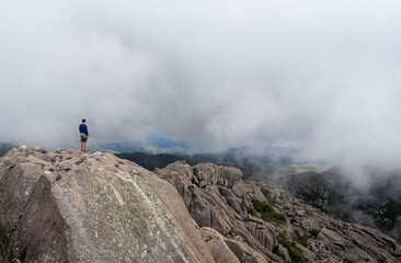 hiker in the foggy mountains