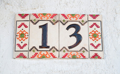 Decorative tiles with number thirteen