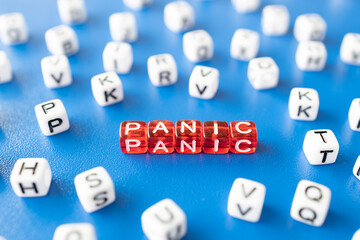 red cubes with the word panic around them white cubes with letters