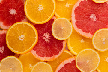 
Citrus background. Slices of grapefruit lemon and orange. Concept of healthy food, diet, top view