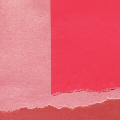 Red and brown torn paper collage close-up. Texture made from various paper and cardboard parts. Damaged old paper background. Vintage blank wallpaper. Material design backdrop.