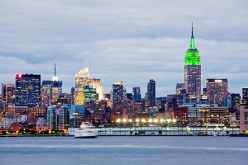 Skyline of midtown Manhattan in New York City illuminated at dusk