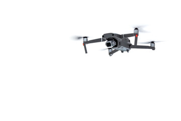 Flying drone quadcopter with a camera isolated on white background