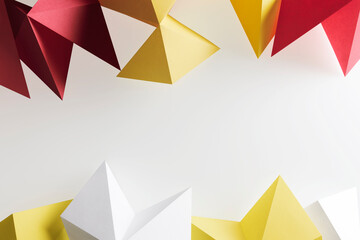 Composition of geometric shapes made colorful paper, white background