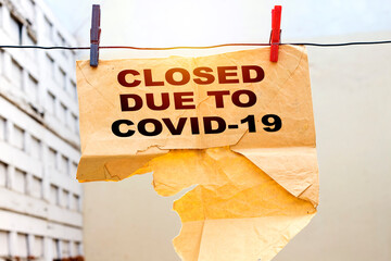 old and tear envelope with closed due to covid-19 concept, bankrupt business due to the effect of novel Coronavirus pandemic