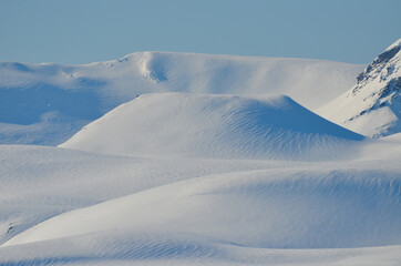 The magical beauty of Svalbard. Unusually blue snow against the clear sky.