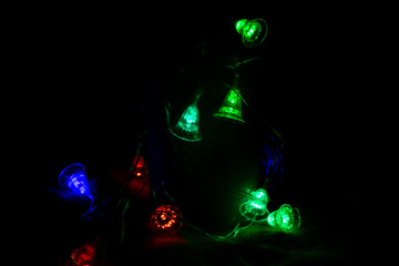 Multicolored bright lanterns on a dark background