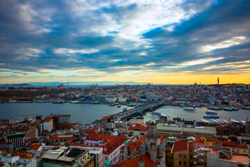 Naklejka premium Cityscape of Istanbul at sunset from Galata Tower. Istanbul background photo. Golden Horn and Historical Peninsula of Istanbul. Travel to Istanbul.