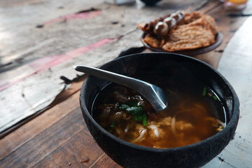 Soto batok. Batok soup is a soup served in a coconut shell bowl. Yogyakarta typical shell soup