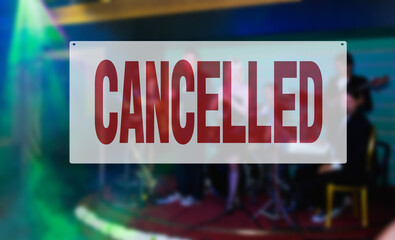 Warning sign saying that music concert is cancelled due to coronavirus