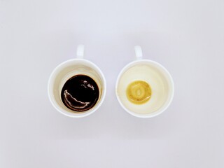 dirty cups after coffee. two empty and dirty cups after coffee on a white background top view