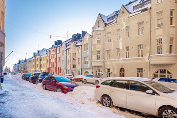 Helsinki, Finland January 4, 2021 Ulyanin, Streets,
   historic buildings covered with snow in sunny, winter weather. Scandinavian architecture.