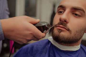 Young Man in Barbershop Hair Care Service Concept