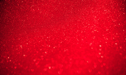 Red background of blurred hearts, side of defocus