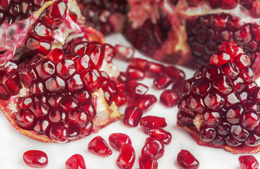 Garnet. Fruit of a juicy pomegranate in a cut.