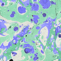 Colorful marble ink texture on watercolor paper background. Marble stone image. Bath bomb effect. Psychedelic biomorphic art.