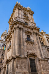 Fototapeta premium View of North facade of Cathedral of Malaga. Renaissance Cathedral - Roman Catholic Church in the city of Malaga, constructed between 1528 and 1782. Malaga, Costa del Sol, Andalusia, Spain.