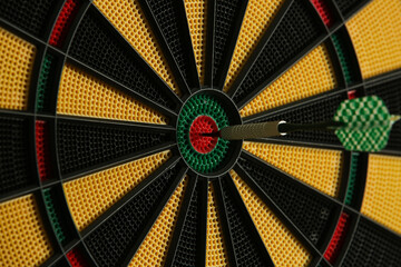 Darts target game. Close up image of dartboard with dart arrow hitting the center. Marketing and...