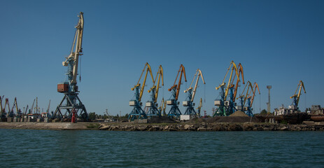 Cranes in the port on a clear sunny day