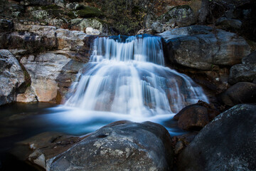 waterfalls of a mountain river in autumn focus selected