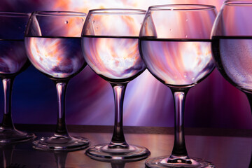 glasses of wine in a row on a beautiful background
