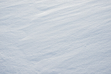 Fresh clean white snow background texture. Winter background with snowflakes and snow mounds. Snow lumps. Seasonal landscape details.