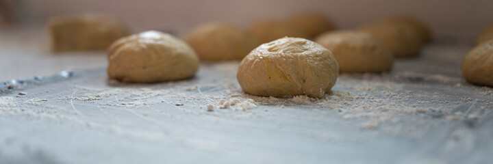 Ball shaped pastry dough for bread or donut resting and rising